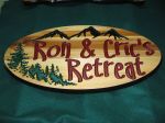 Cottage sign trees mountains